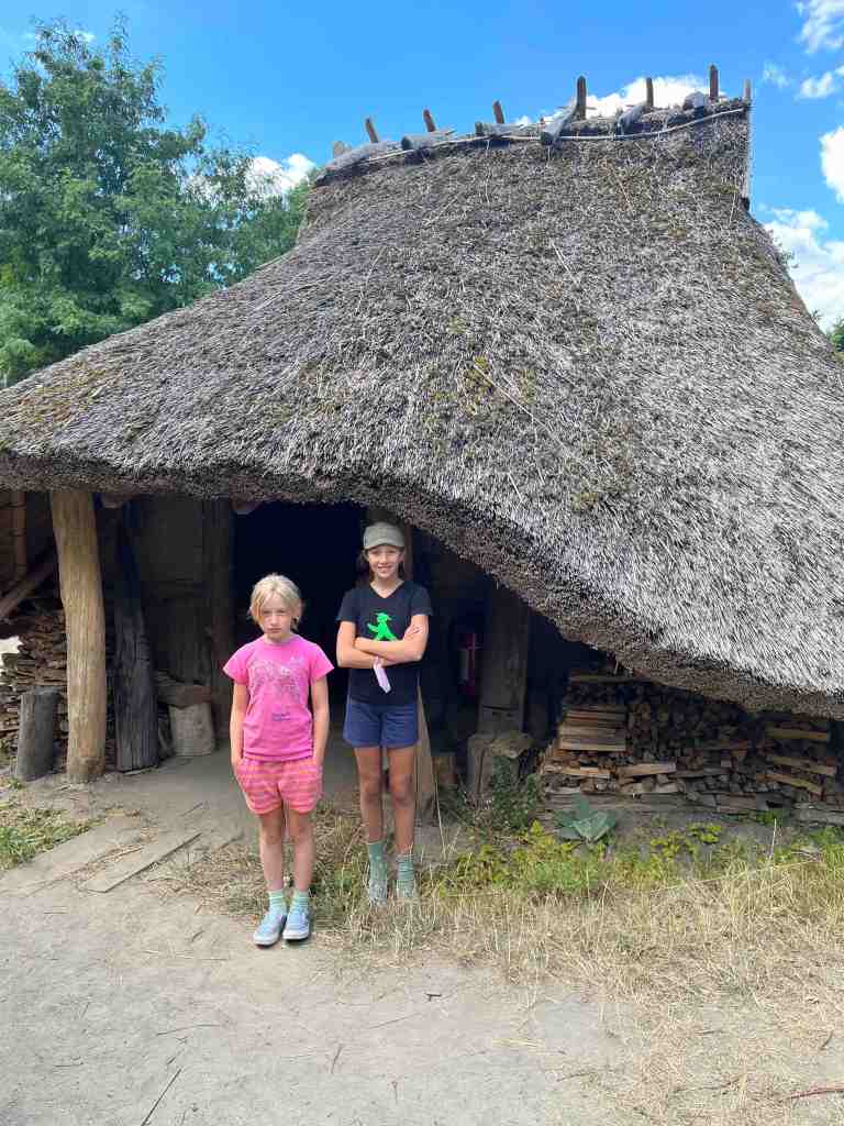 Kids in front of middle ages home
